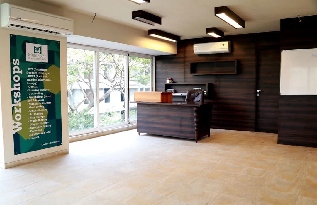 The workshop room at Mindsight Clinic, Malad West, Mumbai, with wood panelling and large windows